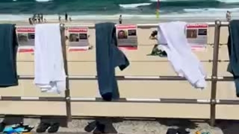 Thumbnail for 239 towels and flip-flops, one for each of the hostages being held captive by Hamas in Gaza.